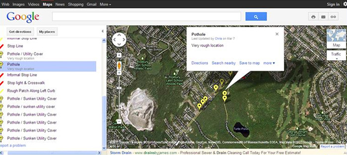 Streetbump screenshot displaying a Google satellite map with markers showing locations of potholes and roadway irregularities
