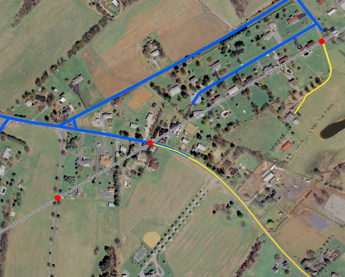 aerial photo of a rural neighborhood marked with blue and yellow lines and three red circles (smap-to points)