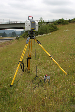photo of a static LiDAR set up near the edge of a highway